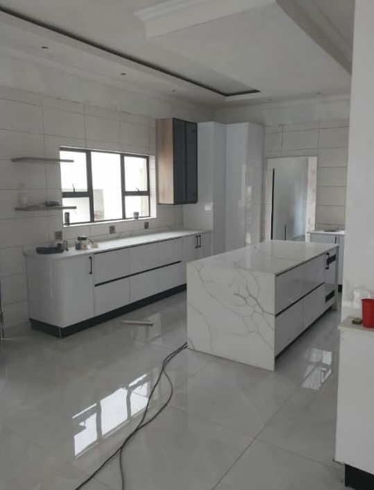 Modern white kitchen with marble island